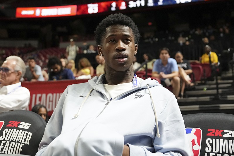 Jul 10, 2025; Las Vegas, NV, USA; Philadelphia 76ers guard VJ Edgecombe (77) watches the game against the San Antonio Spurs from the baseline at Thomas & Mack Center. Mandatory Credit: Candice Ward-Imagn Images