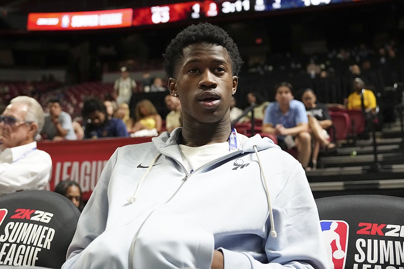 Jul 10, 2025; Las Vegas, NV, USA; Philadelphia 76ers guard VJ Edgecombe (77) watches the game against the San Antonio Spurs from the baseline at Thomas & Mack Center. Mandatory Credit: Candice Ward-Imagn Images