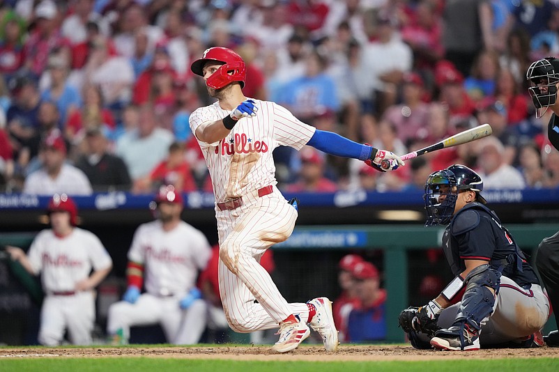 Aug 30, 2025; Philadelphia, Pennsylvania, USA; Philadelphia Phillies infielder Trea Turner (7) hits a double against the Atlanta Braves in the sixth inning at Citizens Bank Park. Mandatory Credit: Kyle Ross-Imagn Images