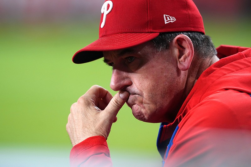 Sep 20, 2025; Phoenix, Arizona, USA; Philadelphia Phillies manager Rob Thomson (49) looks on against the Arizona Diamondbacks during the third inning at Chase Field. Mandatory Credit: Joe Camporeale-Imagn Images