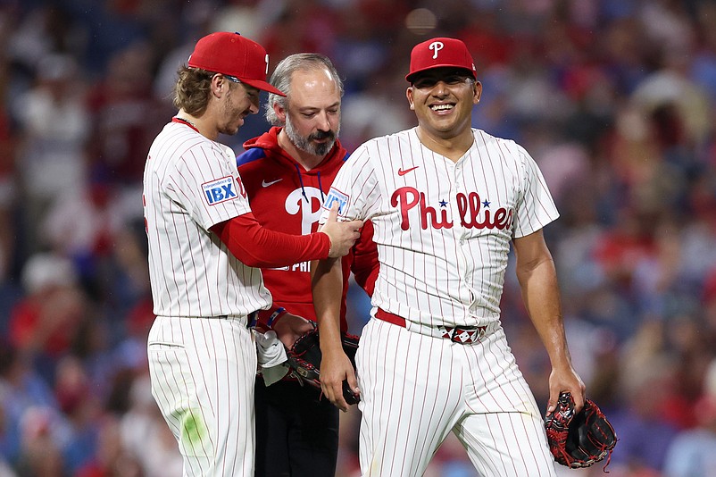 Sep 27, 2025; Philadelphia, Pennsylvania, USA; Philadelphia Phillies pitcher Ranger Suarez (55) is helped by second base Bryson Stott (5) after being hit by a line drive during the fifth inning against the Minnesota Twins at Citizens Bank Park. Mandatory Credit: Bill Streicher-Imagn Images