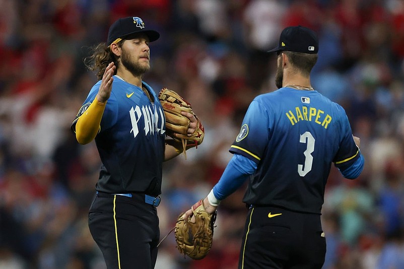 Sep 26, 2025; Philadelphia, Pennsylvania, USA; Philadelphia Phillies third base Alec Bohm (28) and first base Bryce Harper (3) shake hands after a win against the Minnesota Twins at Citizens Bank Park. Mandatory Credit: Bill Streicher-Imagn Images