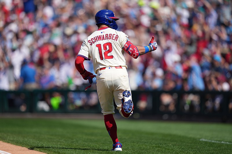 Sep 14, 2025; Philadelphia, Pennsylvania, USA; Philadelphia Phillies designated hitter Kyle Schwarber (12) reacts after hitting a home run against the Kansas City Royals in the first inning at Citizens Bank Park. Mandatory Credit: Kyle Ross-Imagn Images