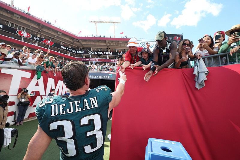 Sep 28, 2025; Tampa, Florida, USA; Philadelphia Eagles cornerback Cooper Dejean (33) high fives fans after the game against the Tampa Bay Buccaneers at Raymond James Stadium. Mandatory Credit: Nathan Ray Seebeck-Imagn Images
