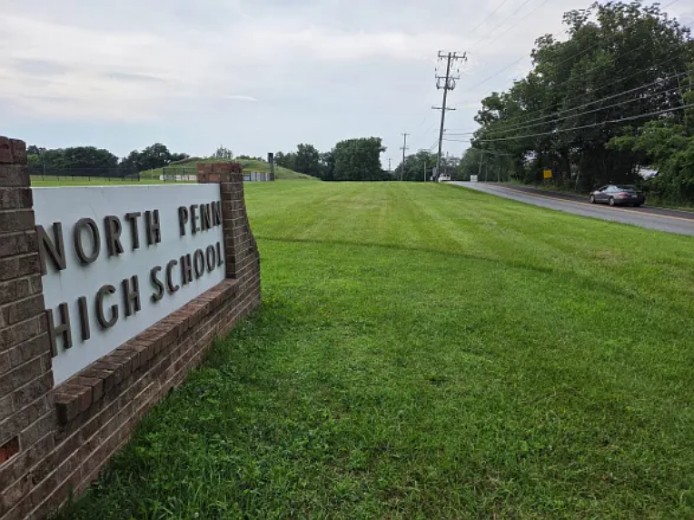 A sign reading “North Penn High School” stands facing Sumneytown Pike in Towamencin in June 2025.