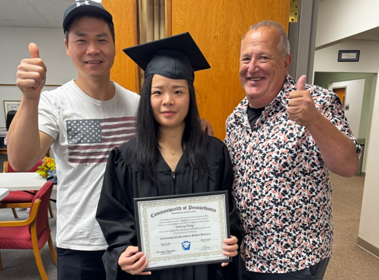Jinfeng Weng completed her GED after taking high school equivalency classes at the Keystone Opportunity Center. (From L to R: Bin Chen Weng, Jinfeng’s husband, Jinfeng Weng and Barry Schwartz, Keystone’s High School Equivalency Coordinator and Instructor.) (Courtesy of Keystone Opportunity Center)