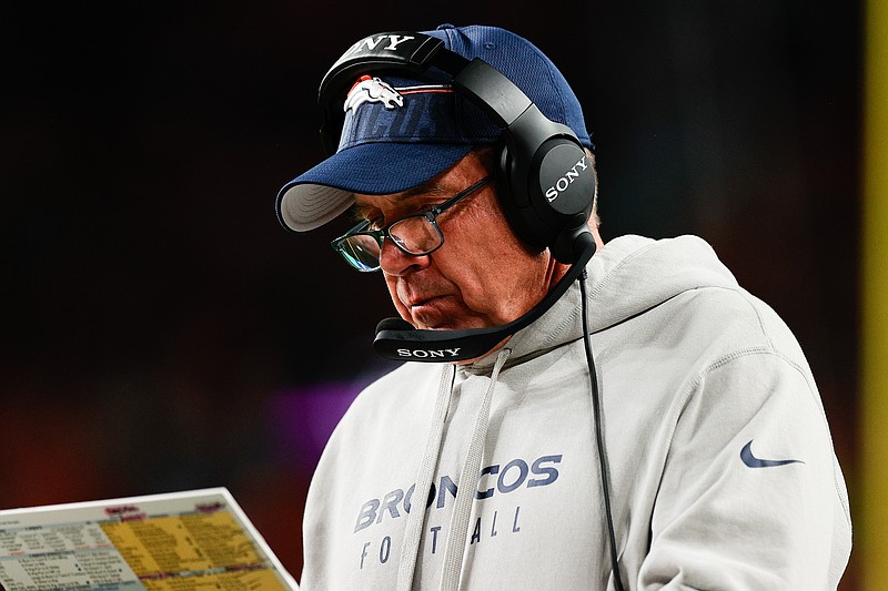 Sep 29, 2025; Denver, Colorado, USA; Denver Broncos head coach Sean Payton looks at his notes during the third quarter against the Cincinnati Bengals at Empower Field at Mile High. Mandatory Credit: Isaiah J. Downing-Imagn Images