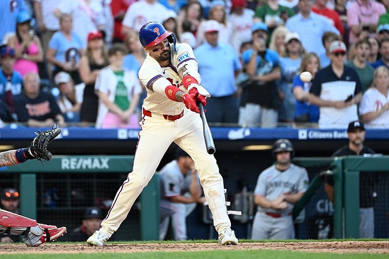 Sep 28, 2025; Philadelphia, Pennsylvania, USA; Philadelphia Phillies outfielder Nick Castellanos (8) hits a game-winning sacrifice fly during the tenth inning against the Minnesota Twins at Citizens Bank Park. Mandatory Credit: Eric Hartline-Imagn Images