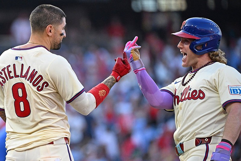 Sep 28, 2025; Philadelphia, Pennsylvania, USA; Philadelphia Phillies outfielder Nick Castellanos (8) celebrate his game-winning sacrifice fly during the tenth inning with outfielder Harrison Bader (2) against the Minnesota Twins at Citizens Bank Park. Mandatory Credit: Eric Hartline-Imagn Images