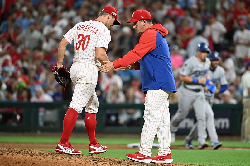Oct 4, 2025; Philadelphia, Pennsylvania, USA; Philadelphia Phillies manager Rob Thomson (49) relieves pitcher David Robertson (30) in the seventh inning against the Los Angeles Dodgers during game one of the NLDS round for the 2025 MLB playoffs at Citizens Bank Park. Mandatory Credit: Eric Hartline-Imagn Images