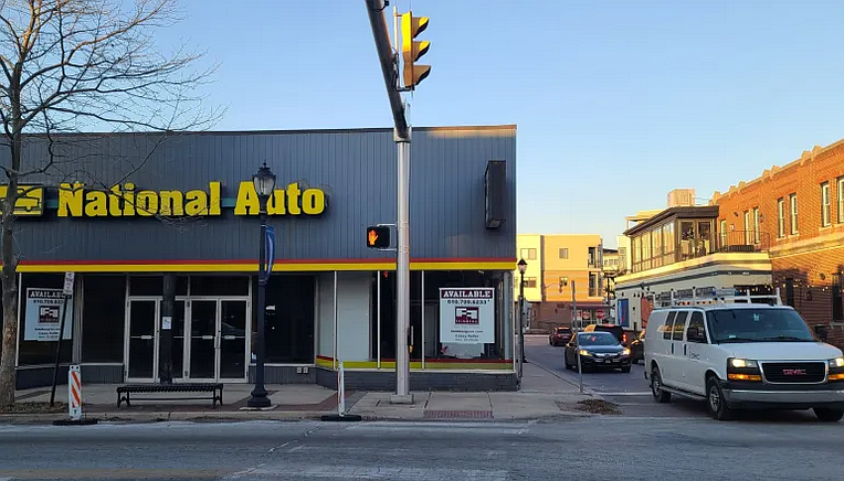Cars drive past the vacant National Auto building on Main Street in Lansdale on Tuesday, Feb. 25, 2025.
