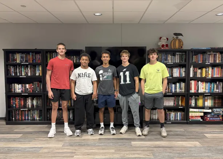 Stephen Keller (center), a Souderton High School senior and BSA Scout Troop 16 member, hopes to share his joy of reading with The Community at Rockhill Personal Care residents. (Courtesy of Grace Inspired Living)
