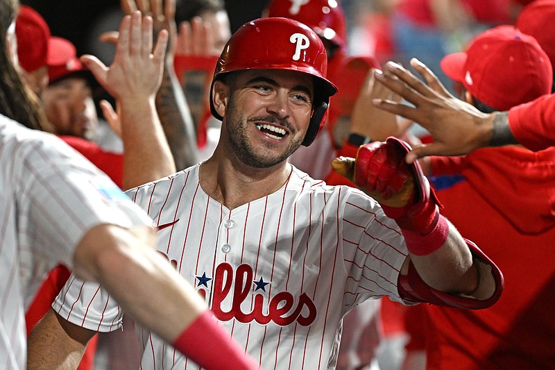Sep 23, 2025; Philadelphia, Pennsylvania, USA; Philadelphia Phillies first base Otto Kemp (4) celebrates his two-run home run in the dugout during the second inning against the Miami Marlins at Citizens Bank Park. Mandatory Credit: Eric Hartline-Imagn Images