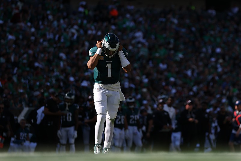 Oct 5, 2025; Philadelphia, Pennsylvania, USA; Philadelphia Eagles quarterback Jalen Hurts (1) walks onto the field after a break in action against the Denver Broncos during the third quarter at Lincoln Financial Field. Mandatory Credit: Bill Streicher-Imagn Images