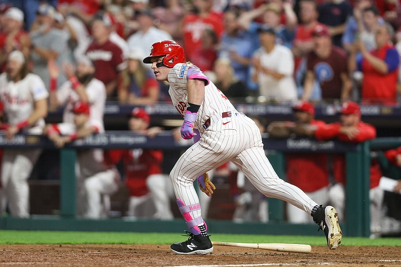 Oct 6, 2025; Philadelphia, Pennsylvania, USA; Philadelphia Phillies pinch hitter Harrison Bader (2) hits a single against the Los Angeles Dodgers in the ninth inning during game two of the NLDS round for the 2025 MLB playoffs at Citizens Bank Park. Mandatory Credit: Bill Streicher-Imagn Images