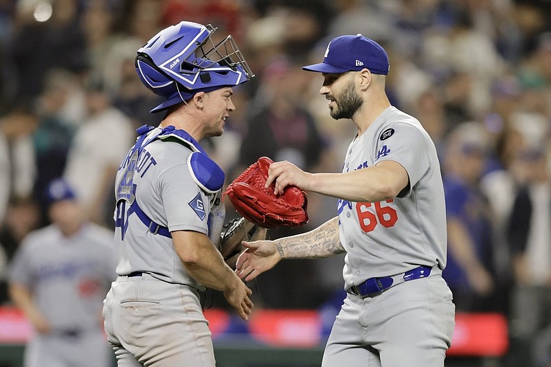 Sep 26, 2025; Seattle, Washington, USA; Los Angeles Dodgers catcher Ben Rortvedt (47) greets pitcher Tanner Scott (66) after the win over the Seattle Mariners at T-Mobile Park. Mandatory Credit: John Froschauer-Imagn Images