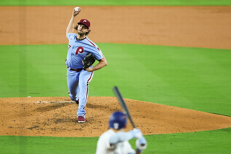 Oct 8, 2025; Los Angeles, California, USA; Philadelphia Phillies pitcher Aaron Nola (27) pitches during the first inning against the Los Angeles Dodgers during game three of the NLDS round for the 2025 MLB playoffs at Dodger Stadium. Mandatory Credit: Kiyoshi Mio-Imagn Images