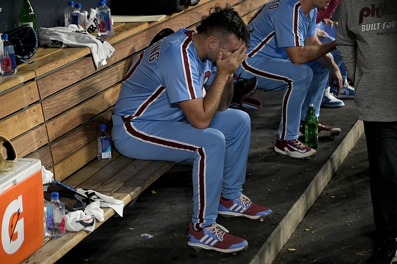 Oct 9, 2025; Los Angeles, California, USA; Philadelphia Phillies pitcher Orion Kerkering (50) in the dugout after the final out as they lost to the Los Angeles Dodgers in game four of the NLDS during the 2025 MLB playoffs at Dodger Stadium. Mandatory Credit: Jayne Kamin-Oncea-Imagn Images