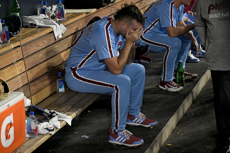Oct 9, 2025; Los Angeles, California, USA; Philadelphia Phillies pitcher Orion Kerkering (50) in the dugout after the final out as they lost to the Los Angeles Dodgers in game four of the NLDS during the 2025 MLB playoffs at Dodger Stadium. Mandatory Credit: Jayne Kamin-Oncea-Imagn Images