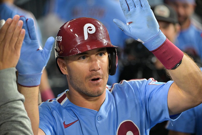 Oct 8, 2025; Los Angeles, California, USA; Philadelphia Phillies catcher J.T. Realmuto (10) celebrates after hitting a solo home run during the eighth inning against the Los Angeles Dodgers during game three of the NLDS round for the 2025 MLB playoffs at Dodger Stadium. Mandatory Credit: Jayne Kamin-Oncea-Imagn Images