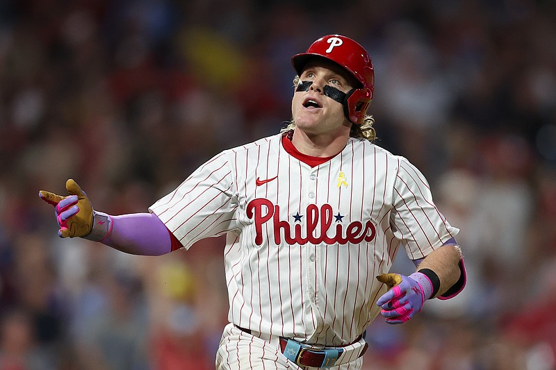 Sep 13, 2025; Philadelphia, Pennsylvania, USA; Philadelphia Phillies outfielder Harrison Bader (2) reacts while running to first base for a single against the Kansas City Royals during the sixth inning at Citizens Bank Park. Mandatory Credit: Bill Streicher-Imagn Images