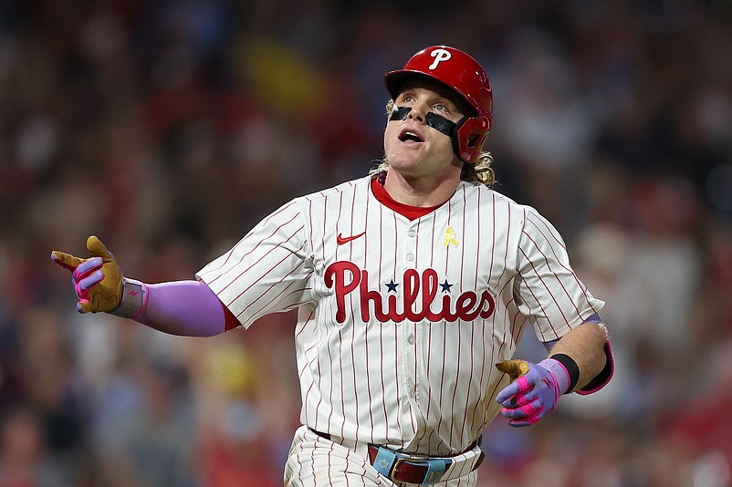 Sep 13, 2025; Philadelphia, Pennsylvania, USA; Philadelphia Phillies outfielder Harrison Bader (2) reacts while running to first base for a single against the Kansas City Royals during the sixth inning at Citizens Bank Park. Mandatory Credit: Bill Streicher-Imagn Images