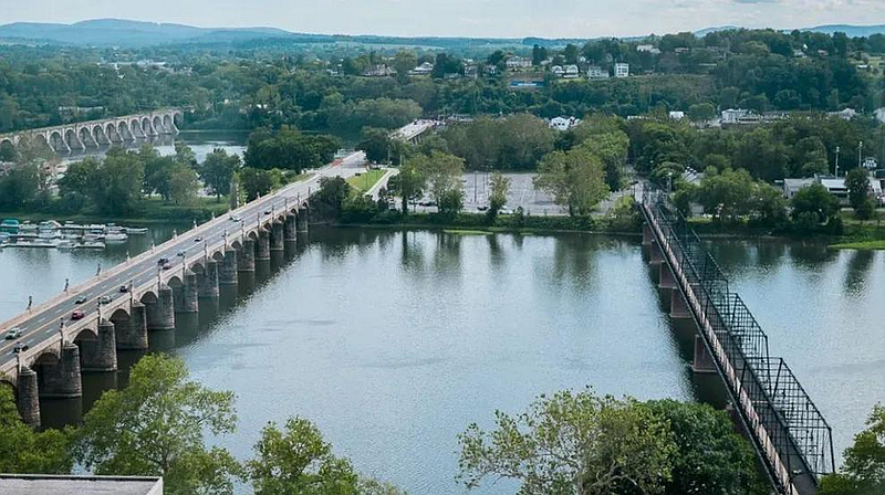 The Susquehanna River in Harrisburg, Pa., with multiple interstates running above it. Photo: Grace David / The Center Square