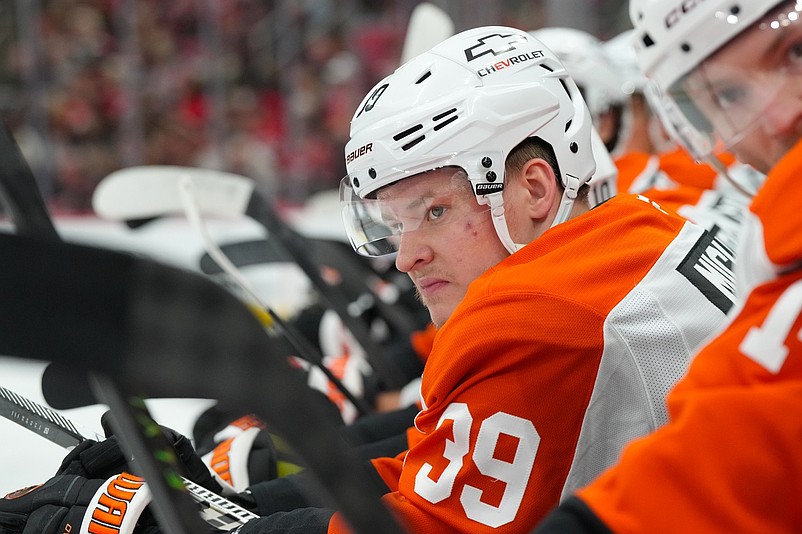 Oct 11, 2025; Raleigh, North Carolina, USA;  Philadelphia Flyers right wing Matvei Michkov (39) looks on from the players bench against the Carolina Hurricanes during the first period at Lenovo Center. Mandatory Credit: James Guillory-Imagn Images