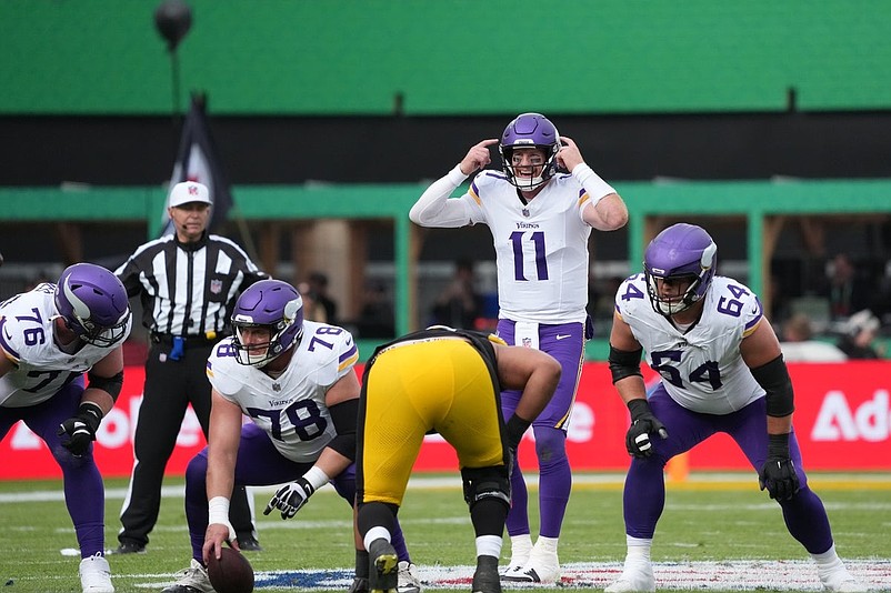 Sep 28, 2025; Dublin, Ireland; Minnesota Vikings quarterback Carson Wentz (11) directs a play during the second quarter against the Pittsburgh Steelers during an NFL International Series game at Croke Park. Mandatory Credit: Kirby Lee-Imagn Images