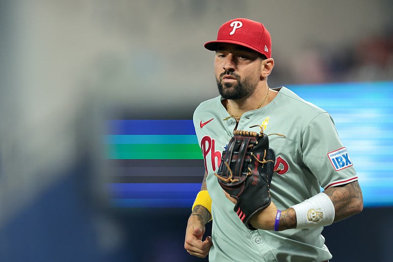 Sep 7, 2025; Miami, Florida, USA; Philadelphia Phillies right fielder Nick Castellanos (8) returns to the dugout against the Miami Marlins during the fifth inning at loanDepot Park. Mandatory Credit: Sam Navarro-Imagn Images