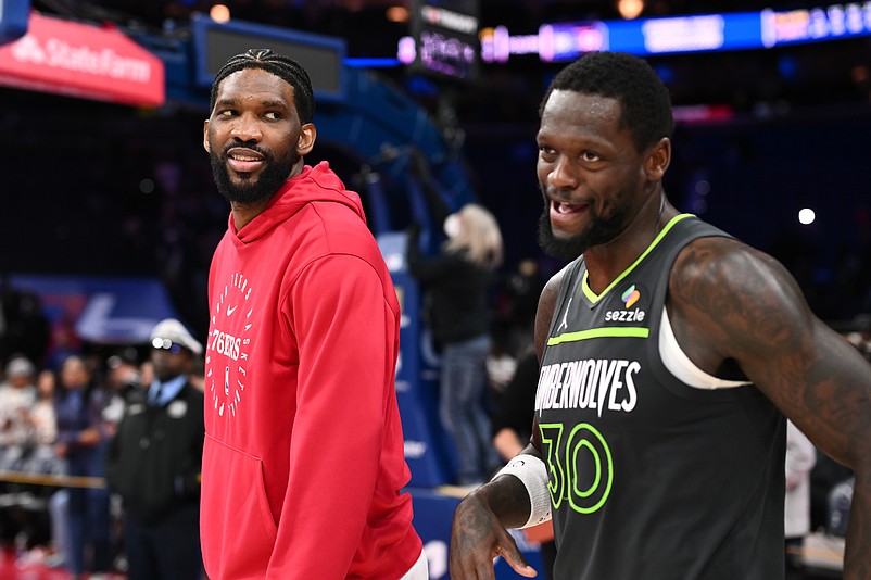 Apr 5, 2025; Philadelphia, Pennsylvania, USA; Philadelphia 76ers center Joel Embiid reacts with Minnesota Timberwolves forward Julius Randle (30) after the game at Wells Fargo Center. Mandatory Credit: Kyle Ross-Imagn Images