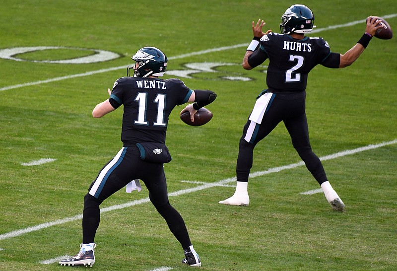 Dec 13, 2020; Philadelphia, Pennsylvania, USA; Philadelphia Eagles quarterback Jalen Hurts (2) and quarterback Carson Wentz (11) warm up before the start of the game against the New Orleans Saints at Lincoln Financial Field. Mandatory Credit: James Lang-USA TODAY Sports