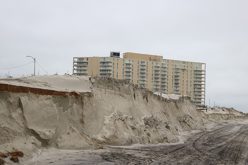 The dunes at Fifth Street in Ocean City are sheared away by the storm to create mini-cliffs.