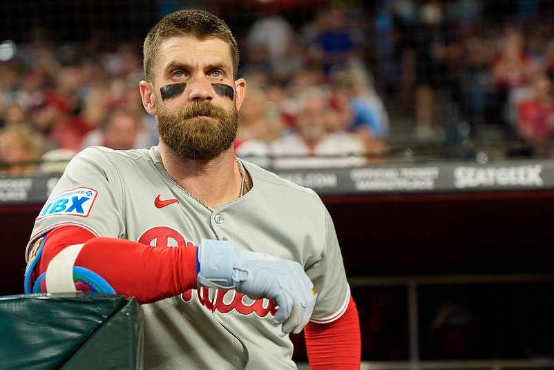 Sep 19, 2025; Phoenix, Arizona, USA;  Philadelphia Phillies infielder Bryce Harper (3) watches on from the dugout before his first at bat of the game against the Arizona Diamondbacks at Chase Field. Mandatory Credit: Allan Henry-Imagn Images
