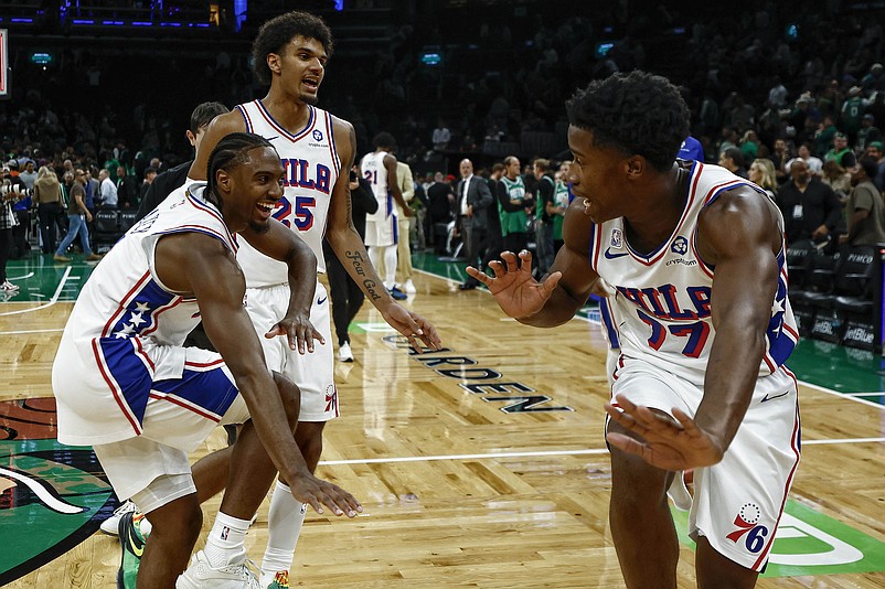 Oct 22, 2025; Boston, Massachusetts, USA; Philadelphia 76ers guard VJ Edgecombe (77) celebrates with guard Tyrese Maxey (0) and forward Dominick Barlow (25) after they defeated the Boston Celtics 117-116 at TD Garden. Mandatory Credit: Winslow Townson-Imagn Images
