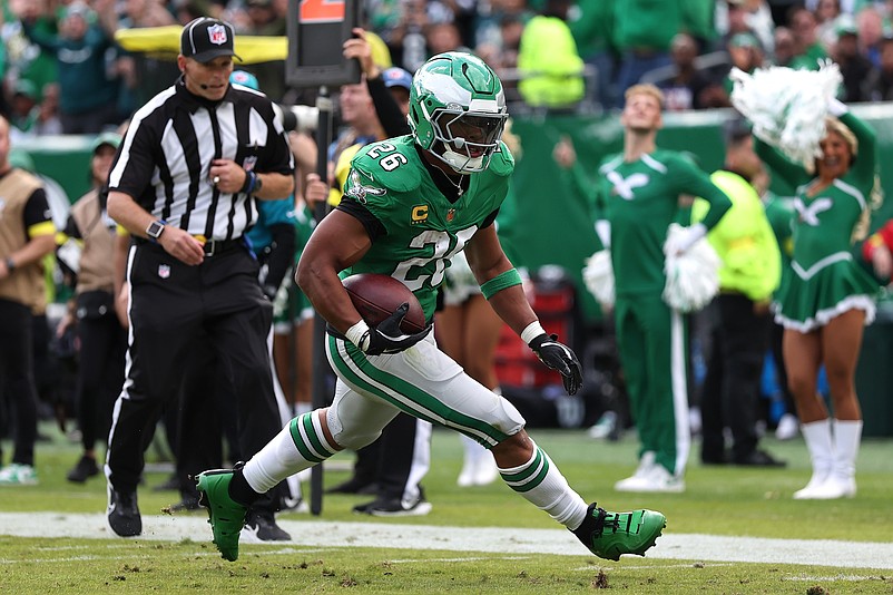 Oct 26, 2025; Philadelphia, Pennsylvania, USA;  Philadelphia Eagles running back Saquon Barkley (26) runs for a touchdown against the New York Giants in the second quarter at Lincoln Financial Field. Mandatory Credit: Bill Streicher-Imagn Images