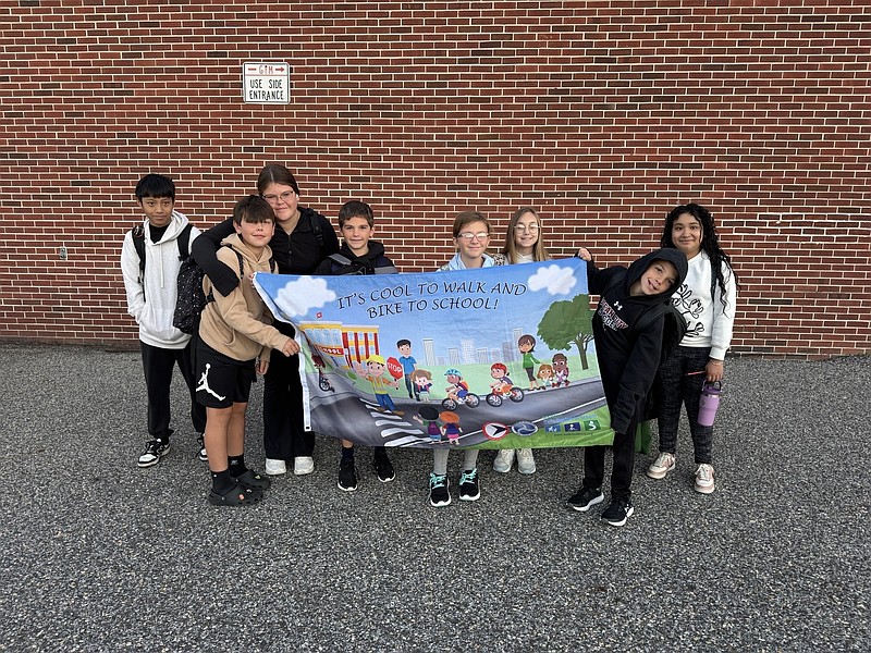 Ocean City Intermediate School students display a banner promoting safe travel habits to celebrate National Walk & Roll to School Day. (Photos courtesy of Ocean City School District)
