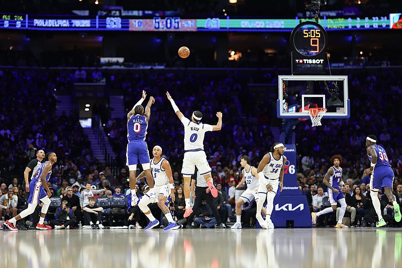 Oct 27, 2025; Philadelphia, Pennsylvania, USA; Philadelphia 76ers guard Tyrese Maxey (0) shoots next to Orlando Magic guard Anthony Black (0) during the second quarter at Xfinity Mobile Arena. Mandatory Credit: Bill Streicher-Imagn Images