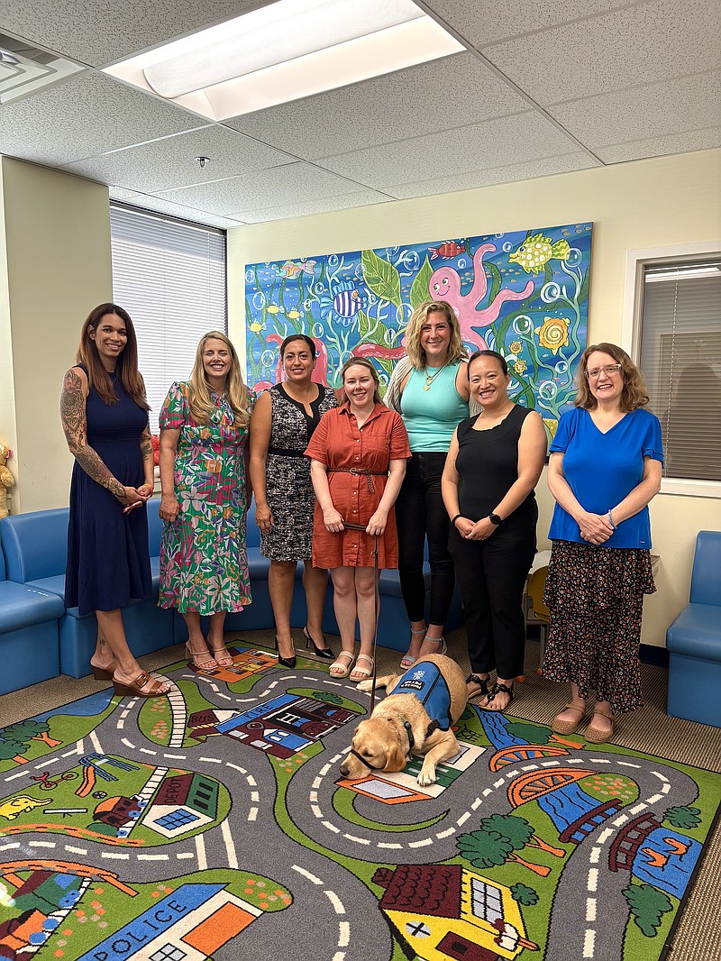 [L-R: Adrienne Cavanaugh (Mission Kids); Leslie Slingsby (Mission Kids); Pam Villagra (Foxwynd Foundation); Liz Nolan (Mission Kids); Clare Henderson (Mission Kids); Jane Kim (Mission Kids); Maggie Rakaczewski (Mission Kids); Lightning (Mission Kids Facility Dog)]