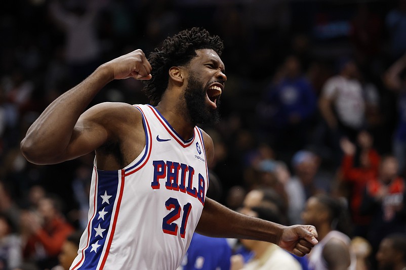 Oct 28, 2025; Washington, District of Columbia, USA; Philadelphia 76ers center Joel Embiid (21) celebrates on the bench against the Washington Wizards in the fourth quarter at Capital One Arena. Mandatory Credit: Geoff Burke-Imagn Images