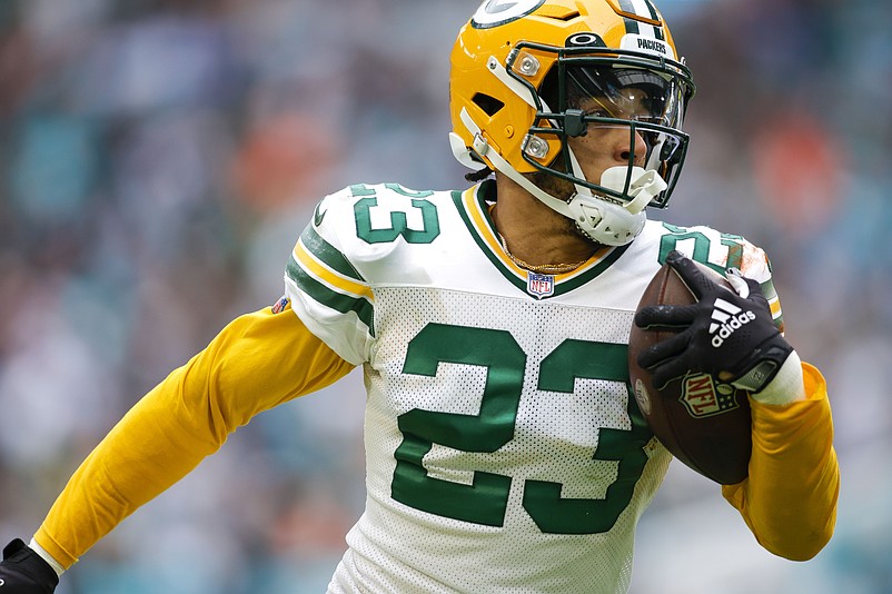 Dec 25, 2022; Miami Gardens, Florida, USA; Green Bay Packers cornerback Jaire Alexander (23) runs with the football after intercepting a pass during the fourth quarter against the Miami Dolphins at Hard Rock Stadium. Mandatory Credit: Sam Navarro-USA TODAY Sports