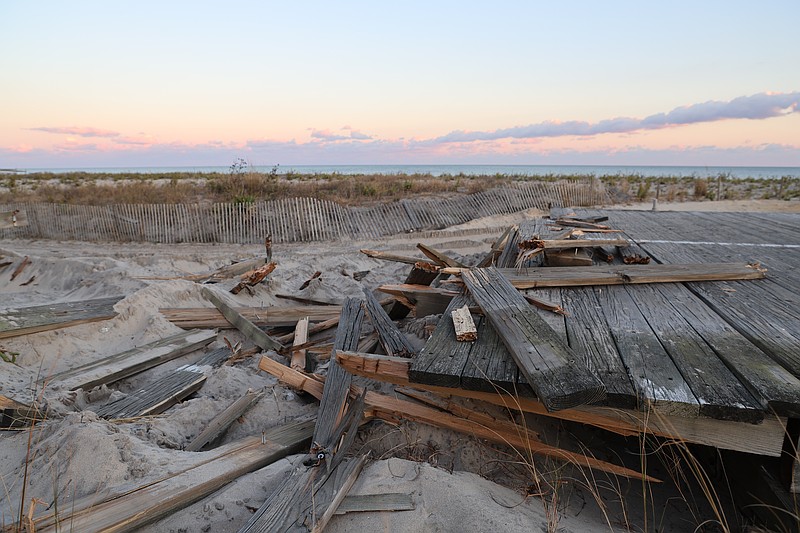 The Boardwalk's old wood decking is being torn up and will be replaced as part of the project. (Photos and video by Max Kelly)