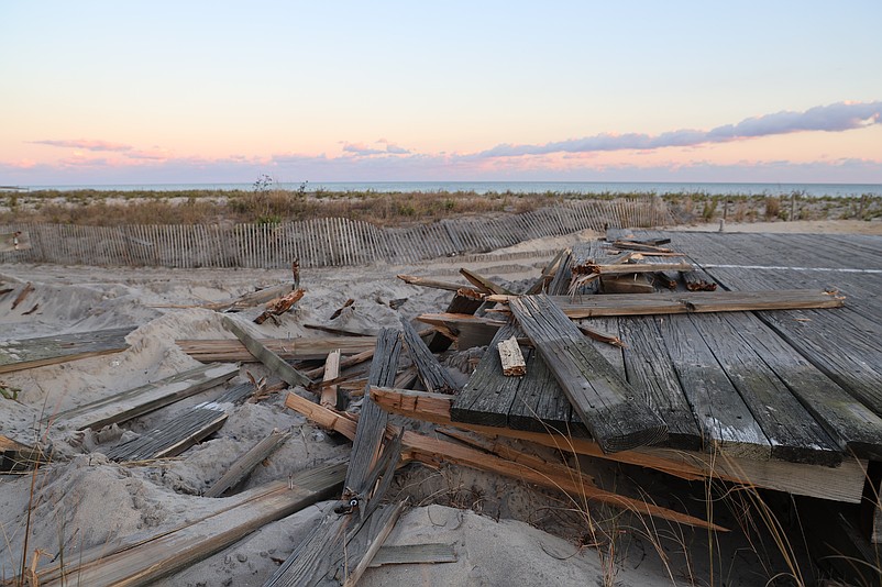 The Boardwalk's old wood decking is being torn up and will be replaced as part of the project. (Photos and video by Max Kelly)