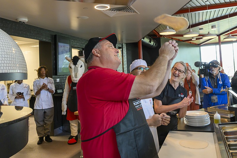 Montgomery County Commissioner Thomas DiBello joined culinary students and President Dr. Vicki Bastecki-Perez at Montgomery County Community College’s Hospitality Institute to make pizza together. Commissioner DiBello formerly owned a pizza shop in his hometown. Photo by Linda Johnson