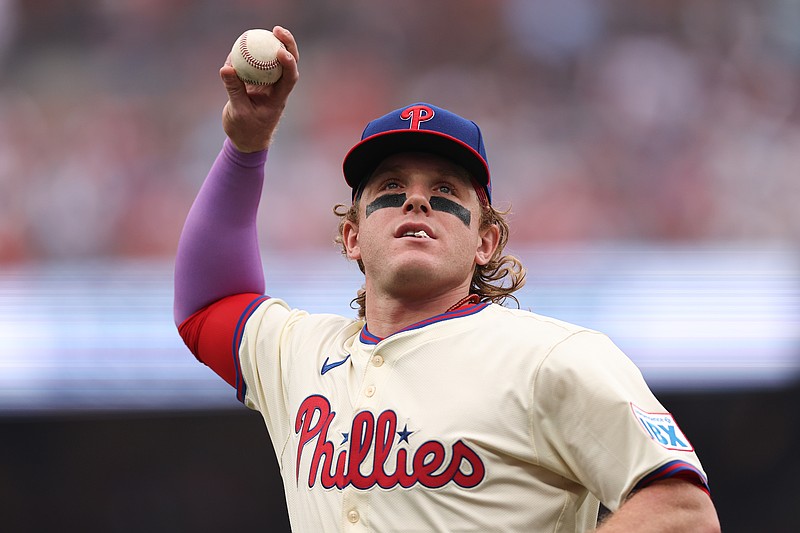Aug 6, 2025; Philadelphia, Pennsylvania, USA; Philadelphia Phillies outfielder Harrison Bader throws a ball to fans in a game against the Baltimore Orioles at Citizens Bank Park. Mandatory Credit: Bill Streicher-Imagn Images