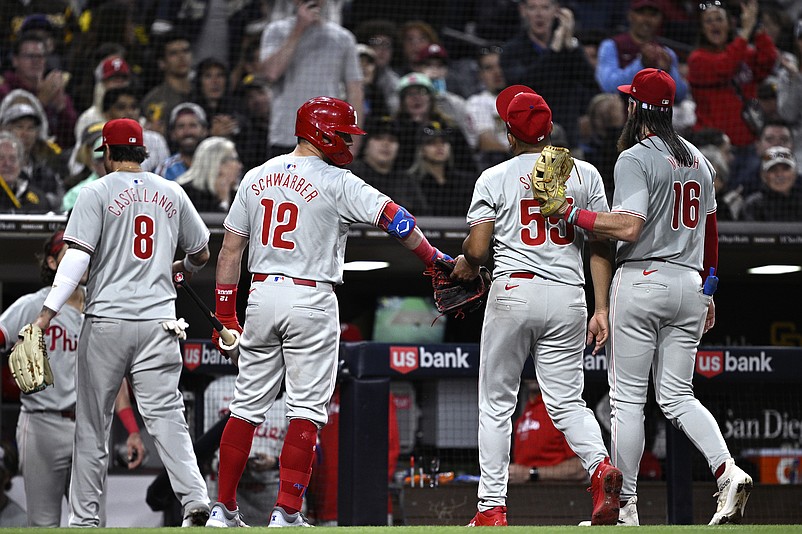 Apr 27, 2024; San Diego, California, USA; Philadelphia Phillies starting pitcher Ranger Suarez (55) is greeted by designated hitter Kyle Schwarber (12) and center fielder Brandon Marsh (16) after pitching the eighth inning against the San Diego Padres at Petco Park. Mandatory Credit: Orlando Ramirez-USA TODAY Sports