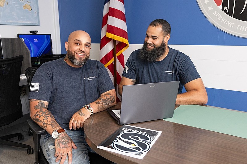 Calvin Washington, right, works with Jose Morales, of Pleasantville, in Stockton University’s Military and Veterans Success Center. The work of the center was celebrated as one of the reasons U.S. Veterans Magazine named Stockton as a Top Veteran Friendly School this week.