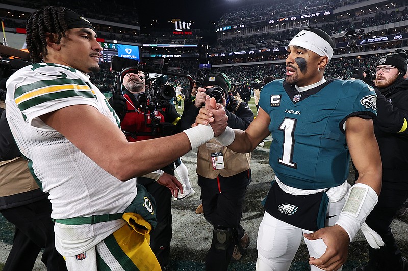 Jan 12, 2025; Philadelphia, Pennsylvania, USA; Green Bay Packers quarterback Jordan Love (10) and Philadelphia Eagles quarterback Jalen Hurts (1) shake hands after the game in an NFC wild card game at Lincoln Financial Field. Mandatory Credit: Bill Streicher-Imagn Images