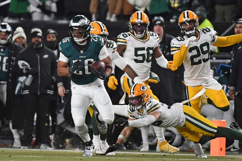 Jan 12, 2025; Philadelphia, Pennsylvania, USA; Philadelphia Eagles running back Saquon Barkley (26) runs against the Green Bay Packers in an NFC wild card game at Lincoln Financial Field. Mandatory Credit: Eric Hartline-Imagn Images