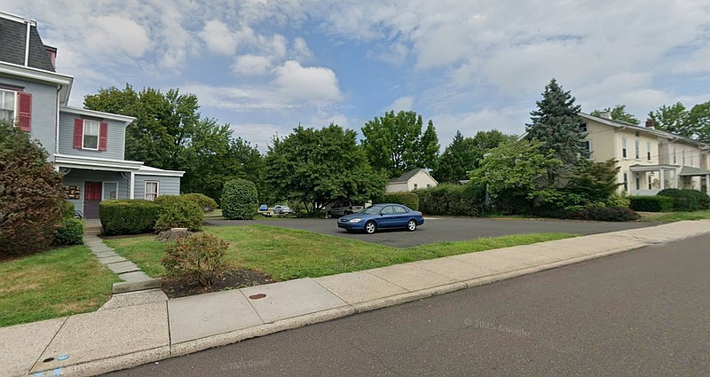 The property at 201-205 Main St in North Wales Borough, along its School Street frontage. Main Street/Sumneytown Pike is toward the left of the picture. (Credit: Google Maps Street View)